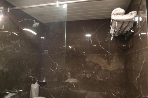 a bathroom with a black marble counter top at Suryaansh in Pālghar