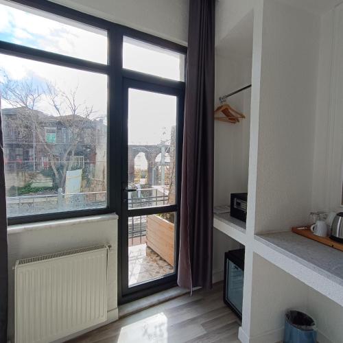 a room with a large window with a view at Efzen hotel in Istanbul