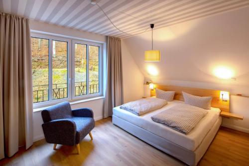 Postel nebo postele na pokoji v ubytování Plumbohms ECHT-HARZ-HOTEL