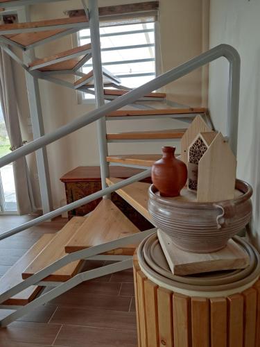 a stack of plates and bowls on a table at EuZoea Country Home in Kapandrítion