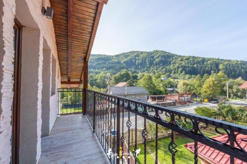 a balcony with a view of a mountain at Casa Zânelor Slănic Moldova in Slănic-Moldova