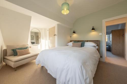 Ένα ή περισσότερα κρεβάτια σε δωμάτιο στο Golf Cottage