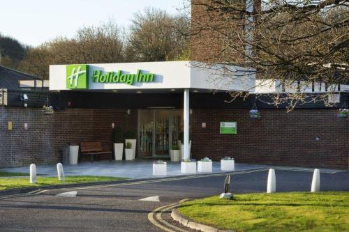 a building with a sign for a holiday inn at Holiday Inn Newport by IHG in Newport