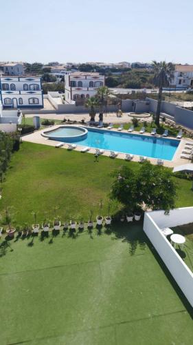 an aerial view of a resort with a swimming pool at TAC - Sagres Studio in Sagres