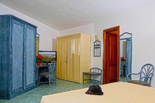 Ένα ή περισσότερα κρεβάτια σε δωμάτιο στο Punta Chiarito Resort