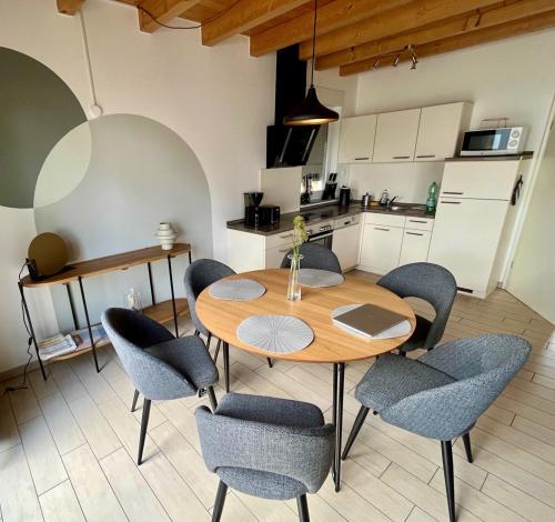 a kitchen and dining room with a table and chairs at Meermaid 2 in Plau am See