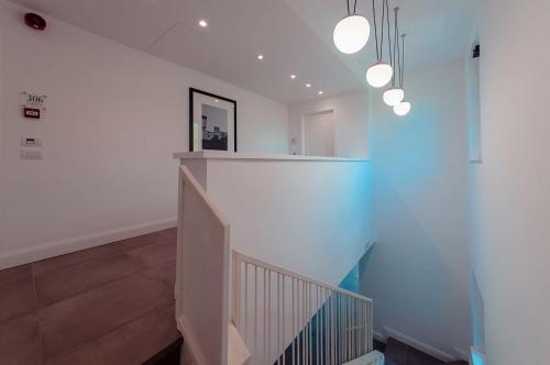 a staircase in a house with white walls at Loriana Park Hotel Sul Lago in Bolsena