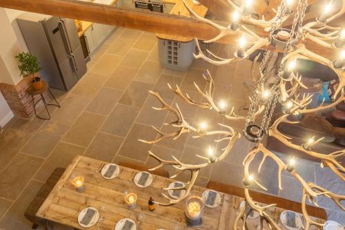 an overhead view of a living room with a chandelier at Hill Farm Massingham in Little Massingham