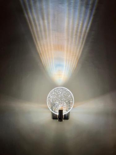 a table with a light in the middle of a room at Palazzo Prence in Copertino