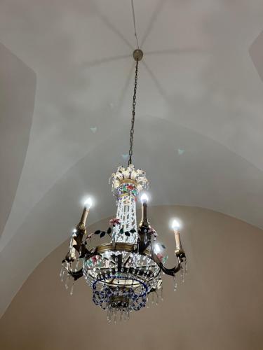 a chandelier hanging from a ceiling at Palazzo Prence in Copertino