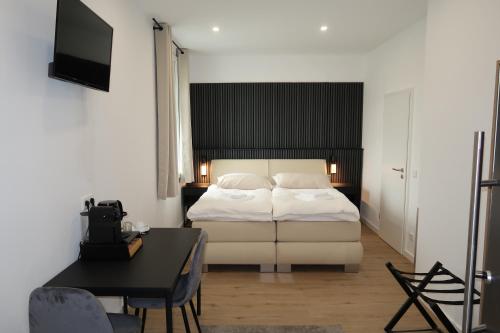 Ένα ή περισσότερα κρεβάτια σε δωμάτιο στο TOKA ROOMS - an der Regiobahn