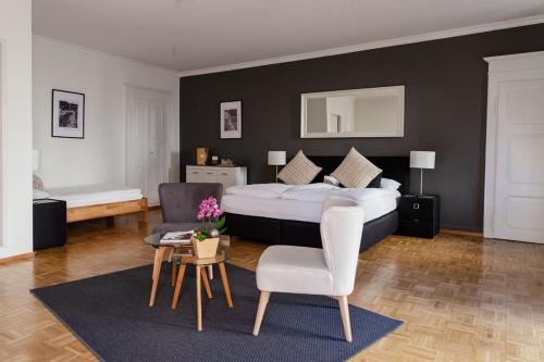 Postel nebo postele na pokoji v ubytování Boutique-Hotel Antica Posta