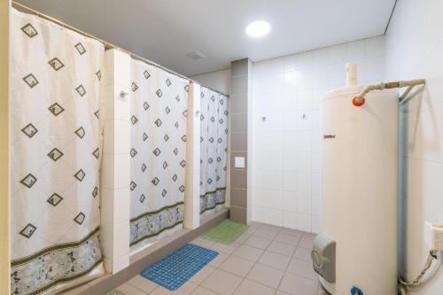 a bathroom with a shower and a toilet at ololoFreelander Hostel&Coworking in Bishkek