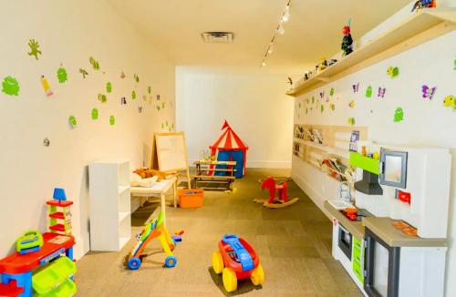 a room with a play room with toys on the wall at Pool - WiFi - Parking - Best Location ! in Kissimmee