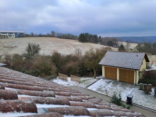 a small house with snow on the roof at Plapperer`s Fewo in Schernfeld