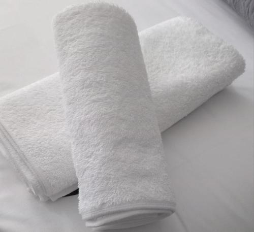 a roll of white toilet paper sitting on a table at Epic Springs Bed & Breakfast in Jwaneng