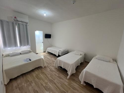 Postel nebo postele na pokoji v ubytování Pousada Recanto Vila Viçosa