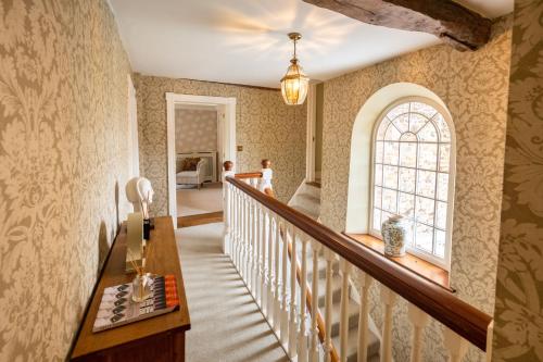 a staircase in a home with a stair case at Ivy Farm 8 in Grimston