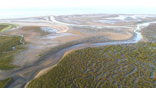 an aerial view of a river with rocks and water at Ivy Farm 8 in Grimston