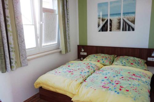 Postel nebo postele na pokoji v ubytování Küstenwald - Ferienwohnung Igelring H