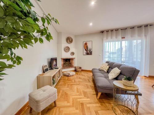 a living room with a couch and a table at Comfortable apartment in Viana do Castelo in Viana do Castelo