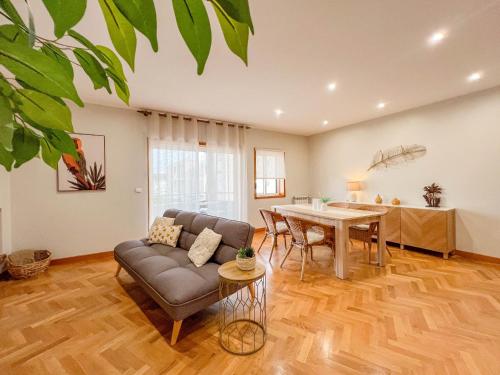 a living room with a couch and a table at Comfortable apartment in Viana do Castelo in Viana do Castelo