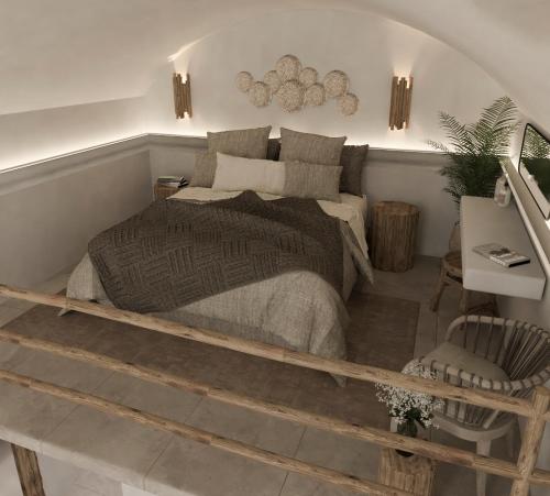 1 dormitorio con 1 cama y 1 silla en The Noverian Bios Santorini Vegan Boutique Hotel en Fira