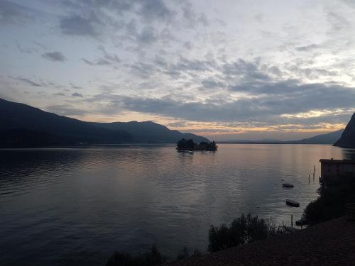 a view of a body of water with mountains at Hotel Bellavista Meublè in Monte Isola