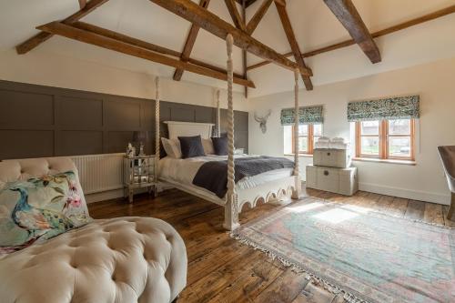 a bedroom with a bed and a swing at Little Star in Ringstead