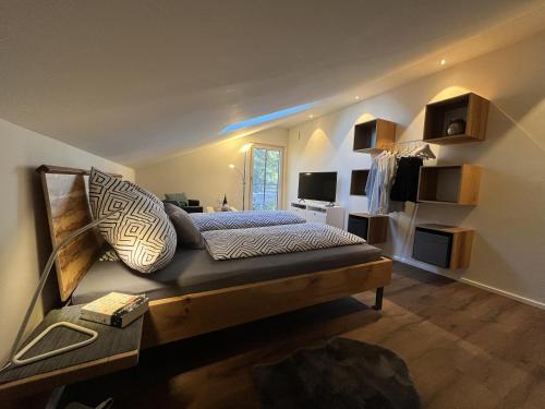 a bedroom with a large bed in a room at Ferienwohnung Rudi in Taching am See