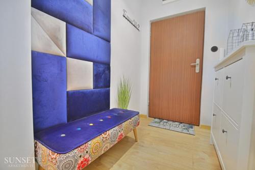 Ένα ή περισσότερα κρεβάτια σε δωμάτιο στο Sunset Apartments - Monte Cassino 39 - przytulna kawalerka przy deptaku z prywatnym parkingiem