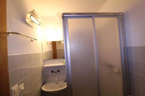 a bathroom with a shower and a toilet and a sink at Chalet Privé avec vue imprenable sur les alpes in Crans-Montana