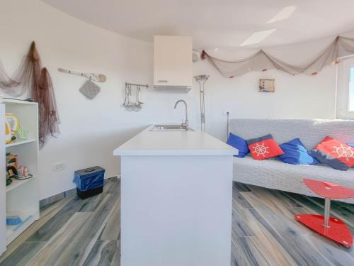 a kitchen with a sink and a bed in a room at Silos Mare in Novigrad Istria