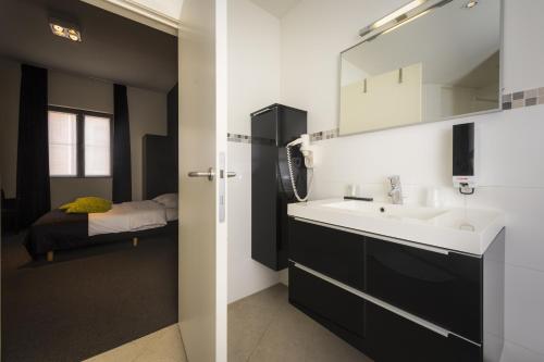 Kuchyň nebo kuchyňský kout v ubytování Hotel Florent