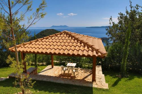 a gazebo with a table and a bench at Villa Columba - Luxury Private Villa in Modern Residence in Sivota