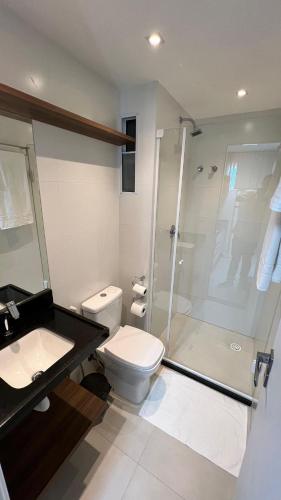a bathroom with a shower and a toilet and a sink at Studios Premium RN in Maceió