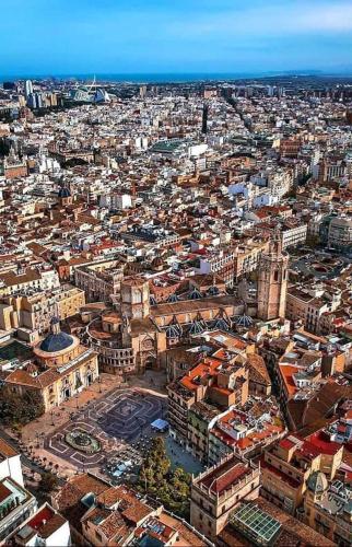 an aerial view of a large city with buildings at Villa Entrenaranjos in Picassent