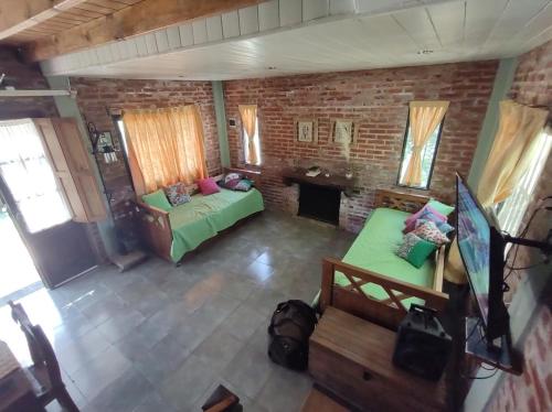an overhead view of a living room with a couch at Hanuja Payé in General Belgrano