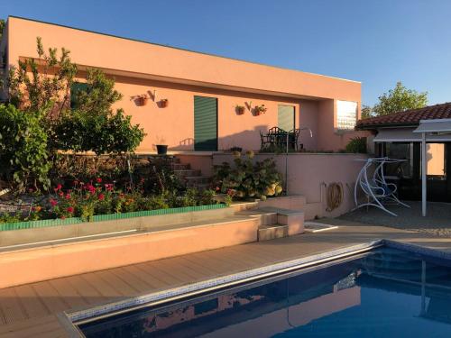 a house with a swimming pool in front of it at Quinta da Penada - Vineyard & Winery - Suíte 3 in Chaves