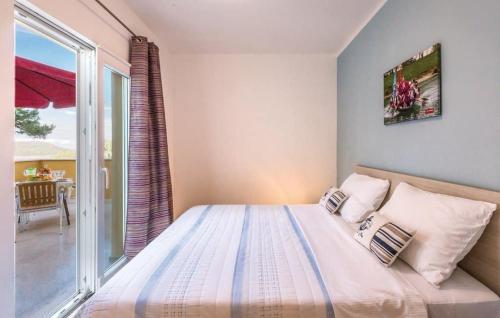 a bedroom with a bed and a large window at Villa Nostra vita in Blace