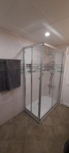 a bathroom with a shower with a glass door at Lanzarote-Beach-Apartment, Las Cucharas Beach, Costa Teguise -- 1 MINUTE WALK FROM MAIN SQUARE, 35 METERS FROM BEACH in Costa Teguise