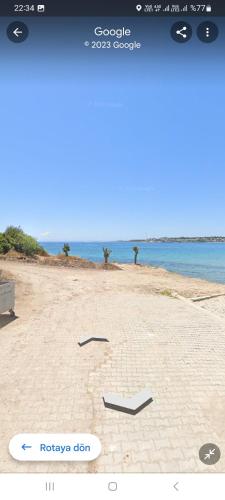 a picture of a beach with the ocean in the background at Otelo in Basaksehir
