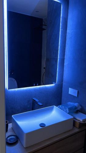a bathroom with a white sink and a mirror at Corso montecarlo in Ventimiglia