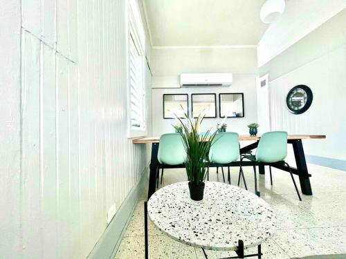 a dining room with a table and two chairs at New! Antique House at Ponce in Ponce
