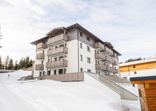 an apartment building in the snow at Haus Tauernblick Katschberg by AlpenTravel inkl Katschberg Summer card in Katschberghöhe