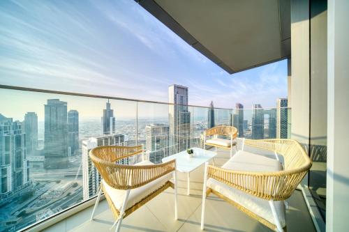 a balcony with a view of the city at Downtown Luxury - Stunning Burj Khalifa & Sea View - 5 Minutes Walk to Dubai Mall in Dubai
