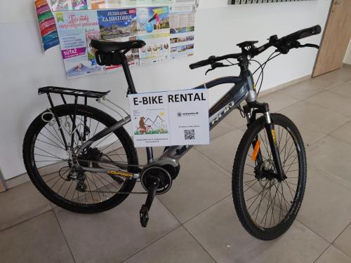 a bike parked in a store with a bike rental sign on it at KUBO TATRY - Starý Smokovec in Smokovce