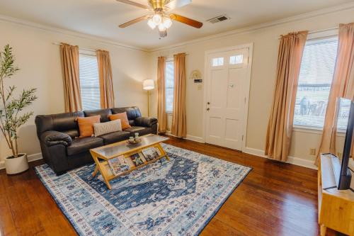 a living room with a couch and a table at Historic Revival King Bed Liberty Bowl Memphis 893 in Memphis