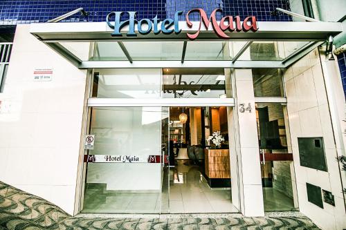 a store front with a sign that reads yoke nana at Hotel Maia in Betim