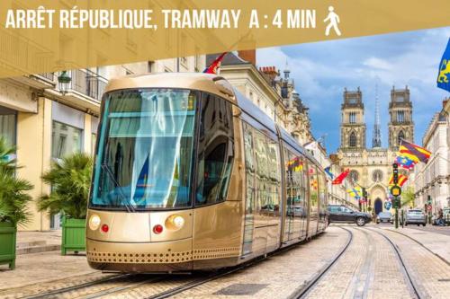 a tram on a street in a city at Somptueux studio Hyper Centre avec WIFI in Orléans